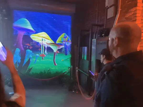 How to use mobile devices as input devices for multi-player interaction in a copresent game on big screens with a low barrier to entry?